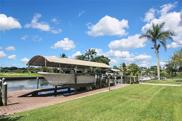 467 Stipe St, North Fort Myers, FL 33903 - dock featuring boat lift, a water view, and a yard