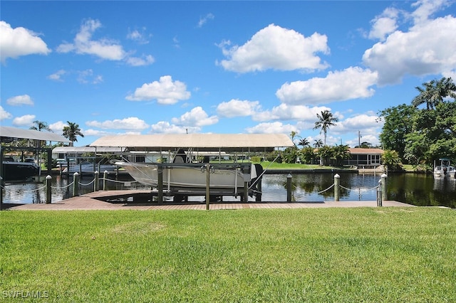 467 Stipe St, North Fort Myers, FL 33903 - dock area with boat lift, a water view, and a yard
