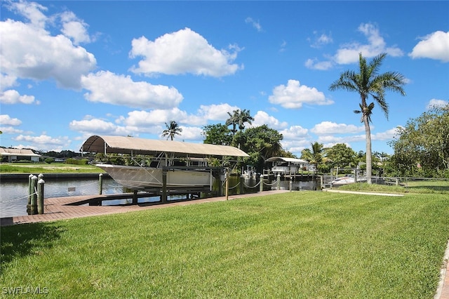 467 Stipe St, North Fort Myers, FL 33903 - dock area featuring boat lift, a yard, and a water view