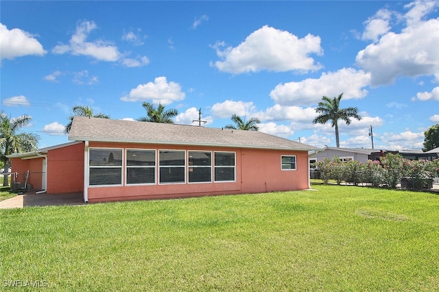 467 Stipe St, North Fort Myers, FL 33903 - back of property featuring a lawn and stucco siding