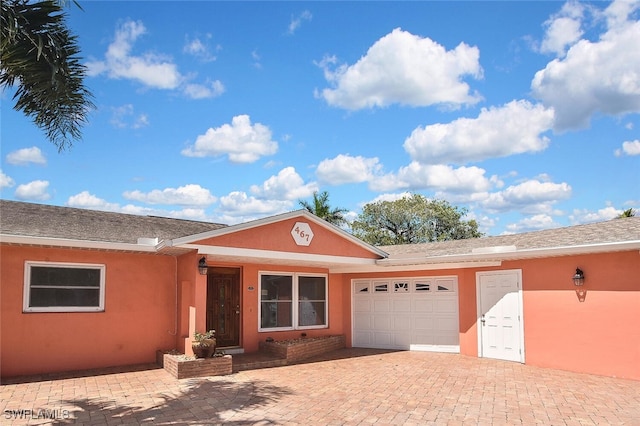 467 Stipe St, North Fort Myers, FL 33903 - single story home with a garage, stucco siding, and decorative driveway