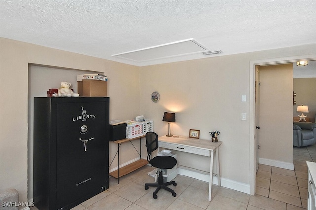 467 Stipe St, North Fort Myers, FL 33903 - home office with light tile patterned flooring, a textured ceiling, and attic access