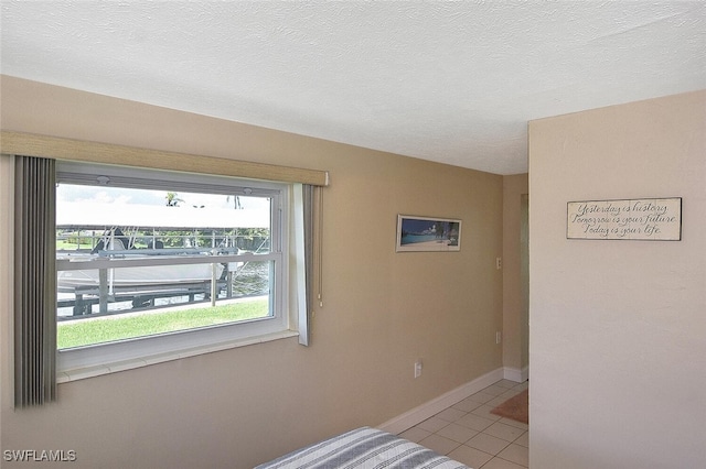467 Stipe St, North Fort Myers, FL 33903 - spare room with light tile patterned floors and baseboards