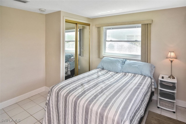 467 Stipe St, North Fort Myers, FL 33903 - bedroom with tile patterned flooring and a closet