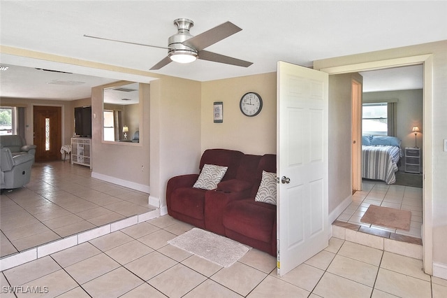 467 Stipe St, North Fort Myers, FL 33903 - living area featuring light tile patterned floors and ceiling fan