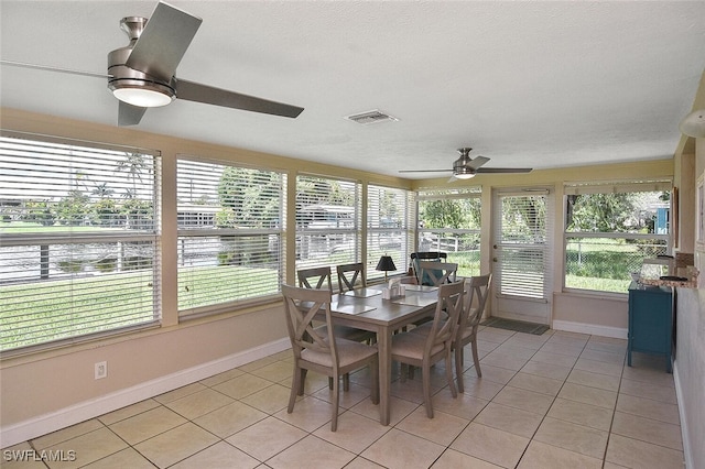 467 Stipe St, North Fort Myers, FL 33903 - sunroom / solarium with a ceiling fan, tile patterned flooring, and healthy amount of natural light