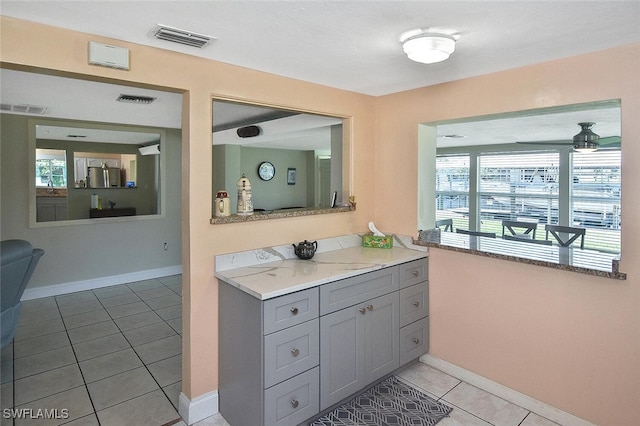 467 Stipe St, North Fort Myers, FL 33903 - bathroom featuring tile patterned flooring, plenty of natural light, vanity, and ceiling fan