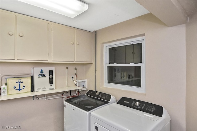 467 Stipe St, North Fort Myers, FL 33903 - laundry area featuring cabinet space and washer and clothes dryer