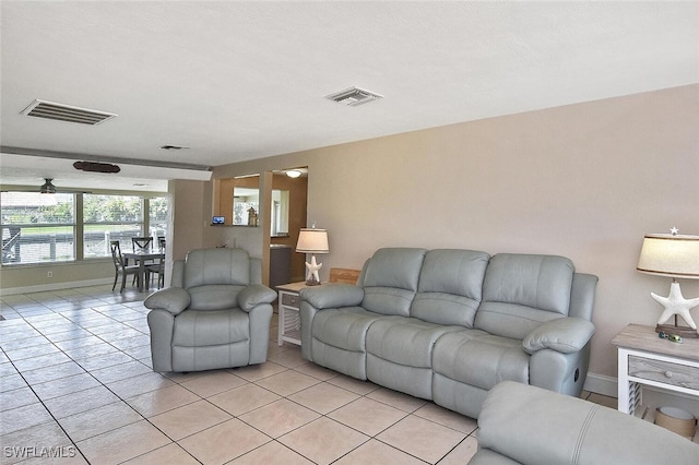 467 Stipe St, North Fort Myers, FL 33903 - living area with baseboards and light tile patterned flooring