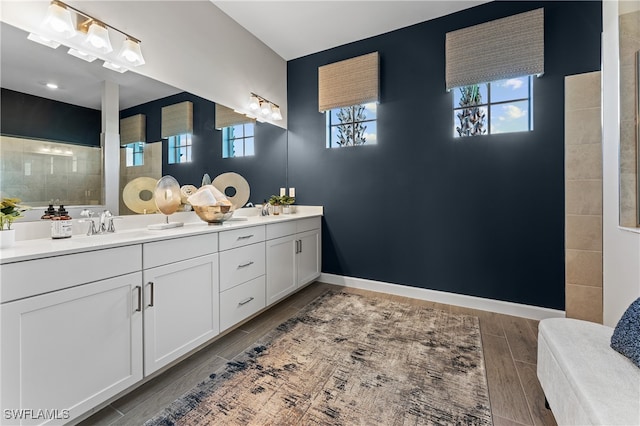 524 Burnt Store Rd S, Cape Coral, FL 33993 - bathroom featuring double vanity, wood finish floors, and a walk in shower