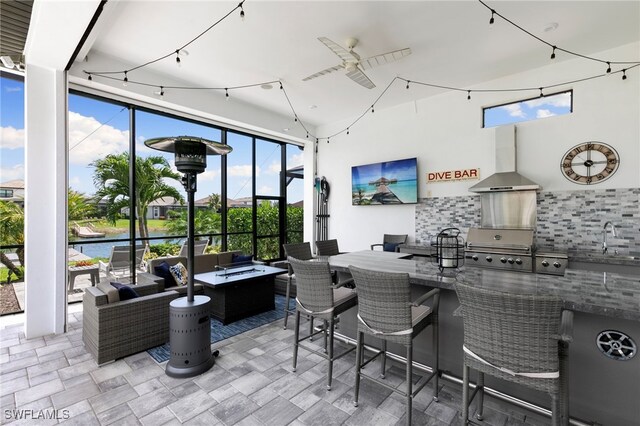 11699 Caleri Ct, Fort Myers, FL 33913 - view of patio featuring outdoor lounge area, a ceiling fan, and an outdoor kitchen