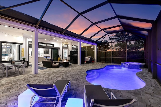 11699 Caleri Ct, Fort Myers, FL 33913 - view of pool with a patio area, a pool with connected hot tub, an outdoor hangout area, and a lanai
