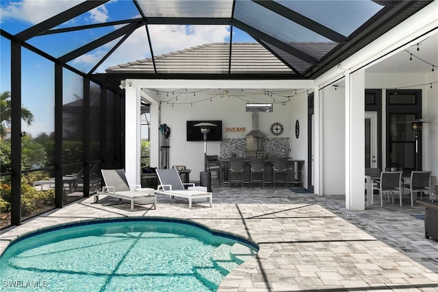 11699 Caleri Ct, Fort Myers, FL 33913 - outdoor pool featuring a patio, ceiling fan, and glass enclosure
