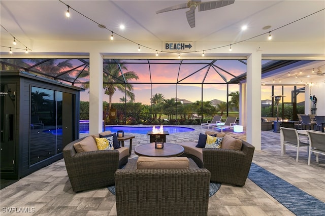11699 Caleri Ct, Fort Myers, FL 33913 - patio terrace at dusk featuring a ceiling fan, an outdoor hangout area, a patio area, and an outdoor pool