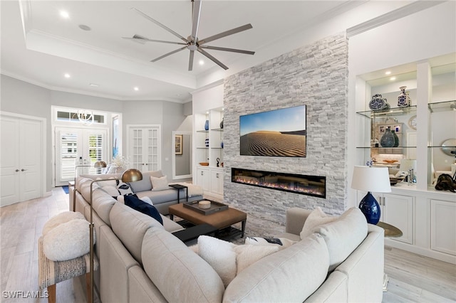 11699 Caleri Ct, Fort Myers, FL 33913 - living area featuring ceiling fan, light wood-style flooring, recessed lighting, built in features, and a stone fireplace