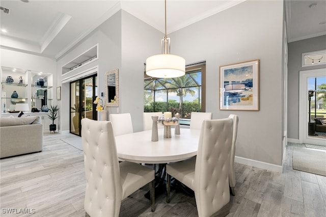 11699 Caleri Ct, Fort Myers, FL 33913 - dining area with crown molding and light wood-style floors