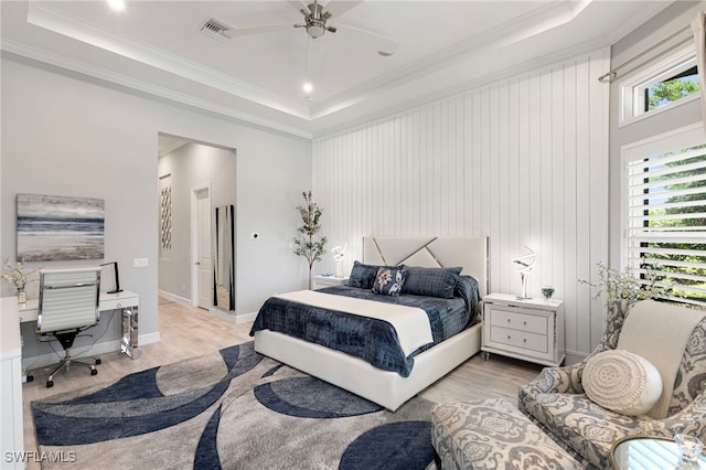 11699 Caleri Ct, Fort Myers, FL 33913 - bedroom featuring a raised ceiling, light wood-style flooring, a desk, ornamental molding, and ceiling fan