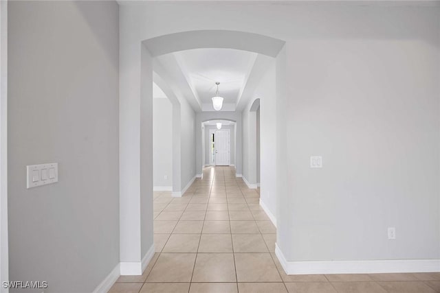 14601 Tropical Dr, Naples, FL 34114 - corridor featuring arched walkways and light tile patterned floors