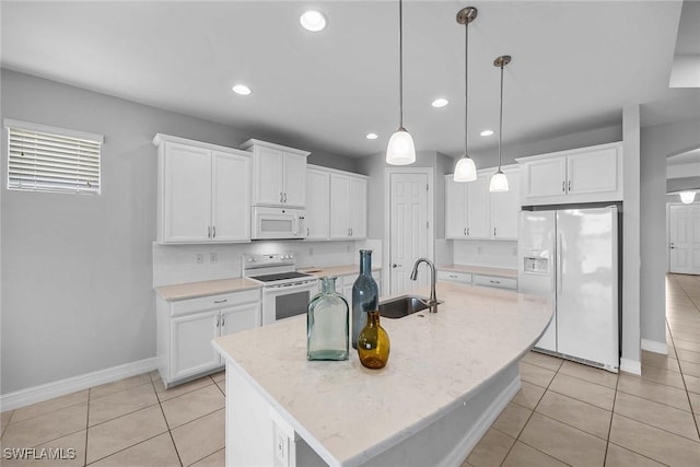 14601 Tropical Dr, Naples, FL 34114 - kitchen featuring white appliances, white cabinetry, decorative light fixtures, recessed lighting, and light tile patterned flooring