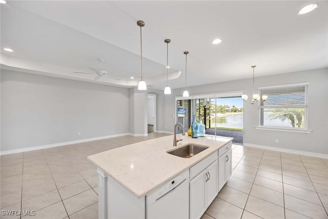 14601 Tropical Dr, Naples, FL 34114 - kitchen with dishwasher, light tile patterned floors, recessed lighting, white cabinets, and pendant lighting