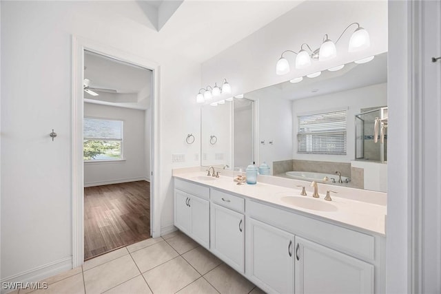 14601 Tropical Dr, Naples, FL 34114 - full bath featuring double vanity, a bath, and tile patterned flooring