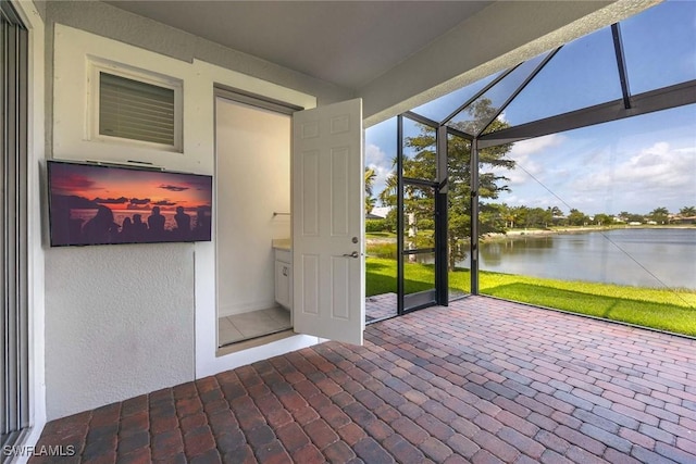 14601 Tropical Dr, Naples, FL 34114 - unfurnished sunroom with a water view