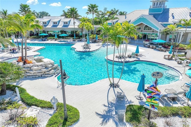 14601 Tropical Dr, Naples, FL 34114 - community pool featuring a patio