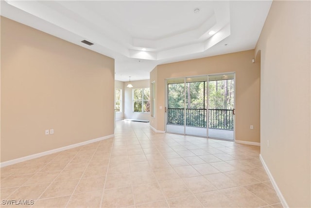 26425 Lucky Stone Rd Unit 201, Bonita Springs, FL 34135 - empty room with a tray ceiling, light tile patterned floors, and recessed lighting
