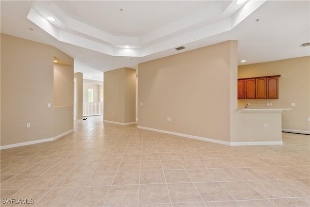 26425 Lucky Stone Rd Unit 201, Bonita Springs, FL 34135 - empty room featuring a tray ceiling, light tile patterned floors, and recessed lighting