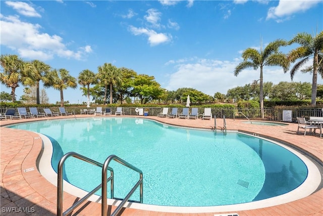 26425 Lucky Stone Rd Unit 201, Bonita Springs, FL 34135 - community pool featuring a patio area and a hot tub