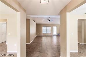 4238 Golfair Ln, North Port, FL 34288 - hall with baseboards and tile patterned floors