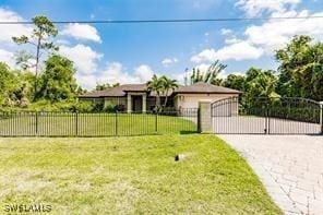 4238 Golfair Ln, North Port, FL 34288 - view of front of house with driveway, a garage, and a gate