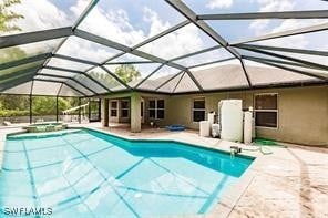 4238 Golfair Ln, North Port, FL 34288 - view of pool with a pool with connected hot tub, a patio area, and a lanai