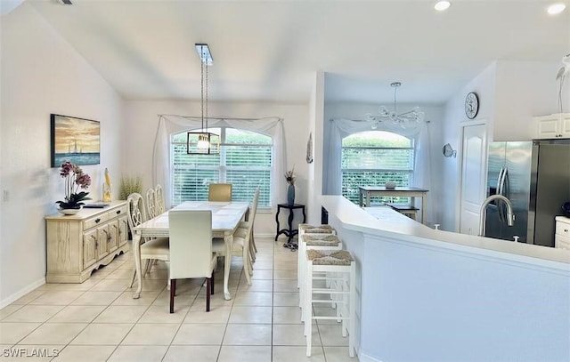 1958 Terrazzo Ln, Naples, FL 34104 - dining space with light tile patterned floors, recessed lighting, and a chandelier