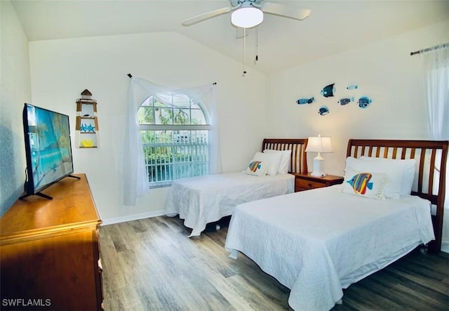 1958 Terrazzo Ln, Naples, FL 34104 - bedroom with wood finished floors, vaulted ceiling, and ceiling fan
