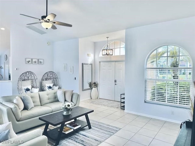 1958 Terrazzo Ln, Naples, FL 34104 - living room with light tile patterned floors and a ceiling fan