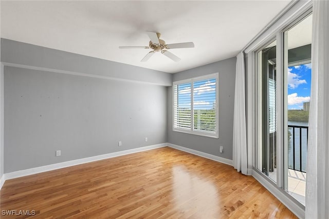420 Cove Tower Dr Unit 304, Naples, FL 34110 - spare room with light wood-style floors and a ceiling fan