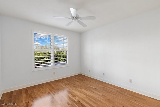 420 Cove Tower Dr Unit 304, Naples, FL 34110 - unfurnished room with light wood finished floors and ceiling fan