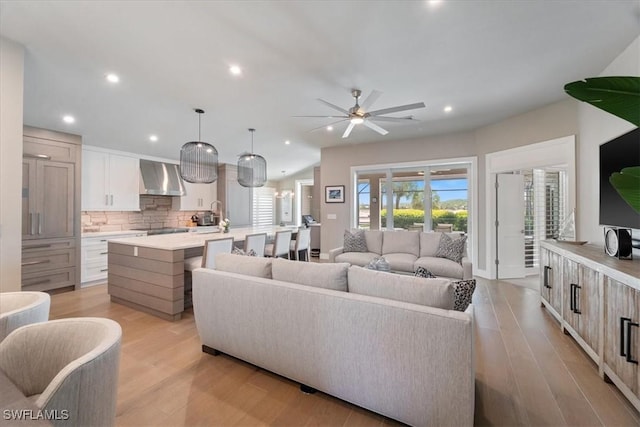 9245 Independence Way, Fort Myers, FL 33913 - living room featuring light wood-style flooring, ceiling fan, and recessed lighting