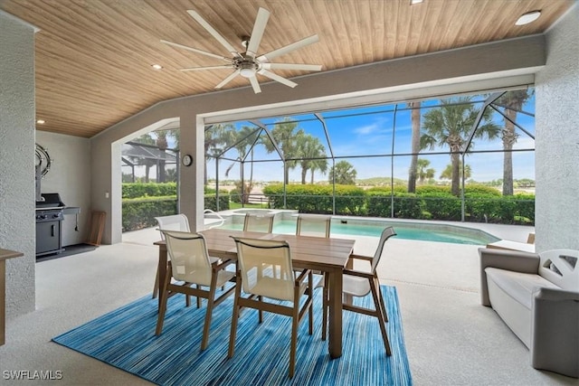 9245 Independence Way, Fort Myers, FL 33913 - view of patio featuring ceiling fan, glass enclosure, an outdoor pool, and outdoor dining area