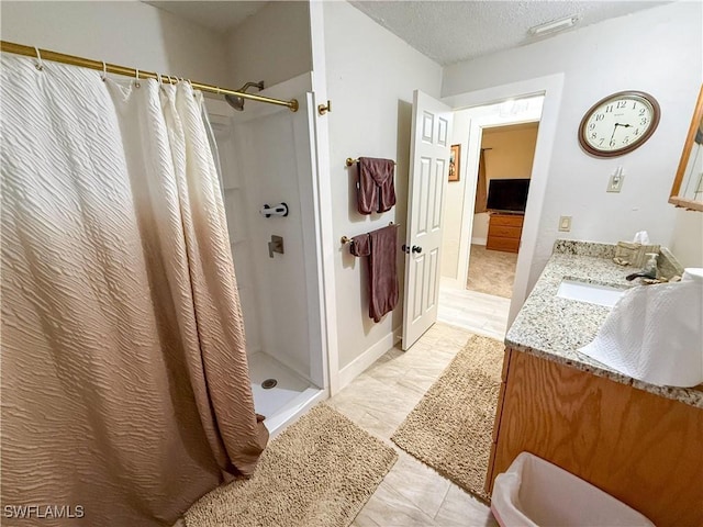 732 Sesame Ct, Cape Coral, FL 33904 - bathroom with curtained shower, vanity, and a textured ceiling