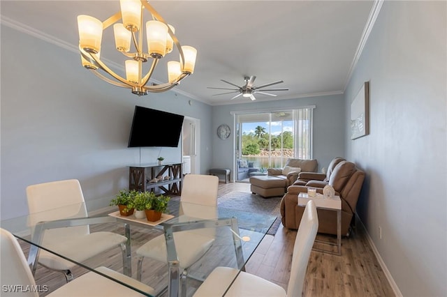 7625 Arbor Lakes Ct Unit 315, Naples, FL 34112 - dining room with ornamental molding, wood finished floors, a ceiling fan, and a chandelier