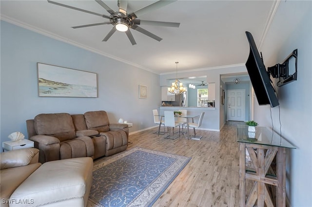 7625 Arbor Lakes Ct Unit 315, Naples, FL 34112 - living room featuring ornamental molding, a chandelier, light wood-style floors, and a ceiling fan