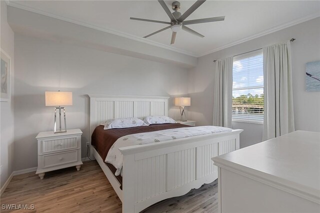 7625 Arbor Lakes Ct Unit 315, Naples, FL 34112 - bedroom featuring ornamental molding, light wood-type flooring, and a ceiling fan