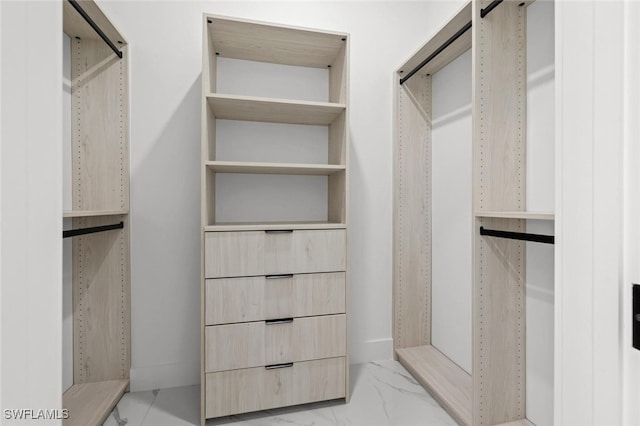 2302 SW 16th Ter, Cape Coral, FL 33991 - walk in closet featuring light marble finish flooring