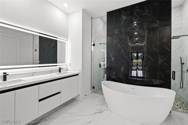 2302 SW 16th Ter, Cape Coral, FL 33991 - full bath featuring marble tiled flooring, a freestanding tub, double vanity, a marble finish shower, and recessed lighting
