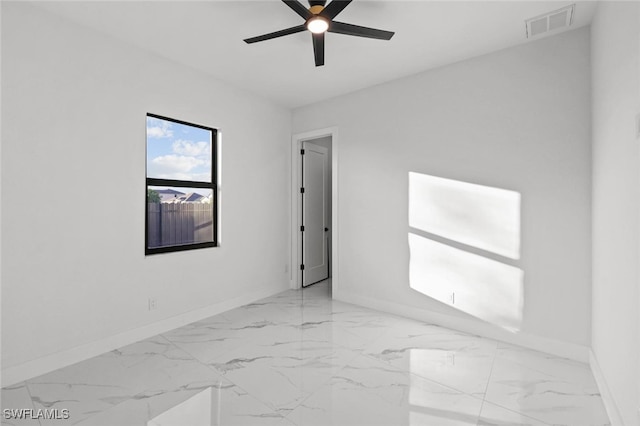 2302 SW 16th Ter, Cape Coral, FL 33991 - unfurnished room with marble finish floors and a ceiling fan
