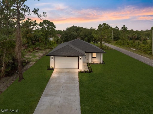 2701 53rd St W, Lehigh Acres, FL 33971 - view of front of property with concrete driveway, a yard, an attached garage, and roof with shingles