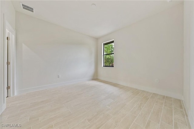 2701 53rd St W, Lehigh Acres, FL 33971 - unfurnished room featuring light wood-style floors and vaulted ceiling