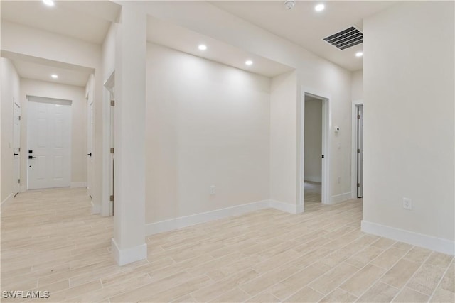 2703 54th St W, Lehigh Acres, FL 33971 - unfurnished room with light wood finished floors and recessed lighting